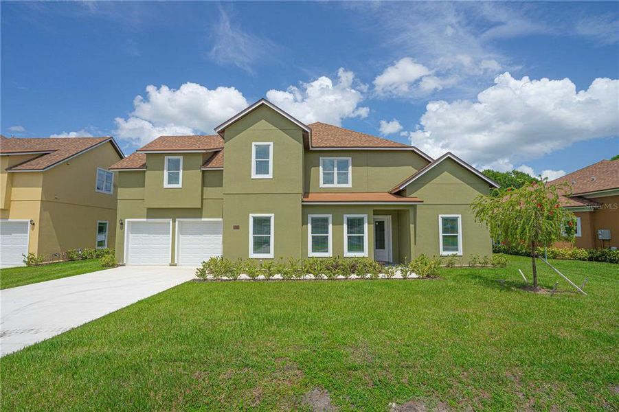 Front exterior of a new home in , Sanford, FL, highlighting curb appeal (Image 22).