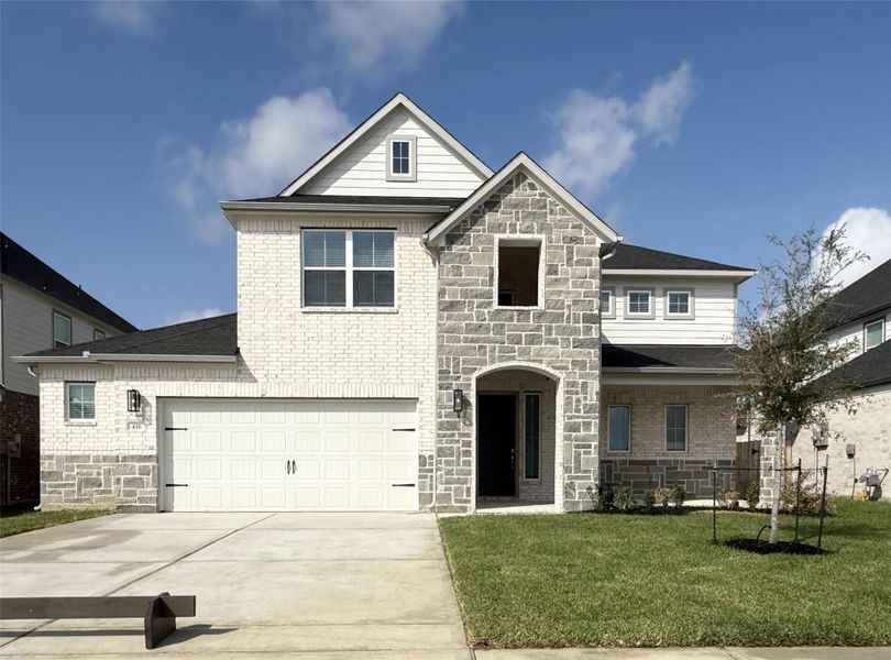 Front exterior of a new home in Beacon Hill, Waller, TX, highlighting curb appeal (Image 1).