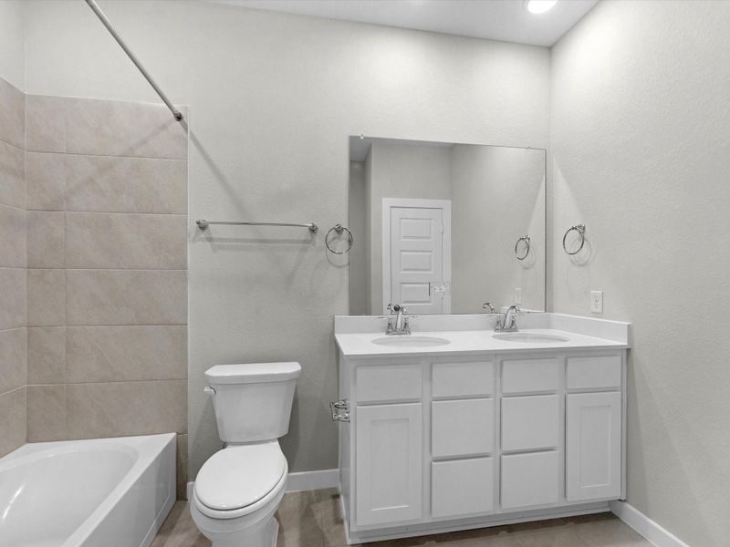 Furnished interior view inside a new home in Mason Woods, Cypress (Image 7).