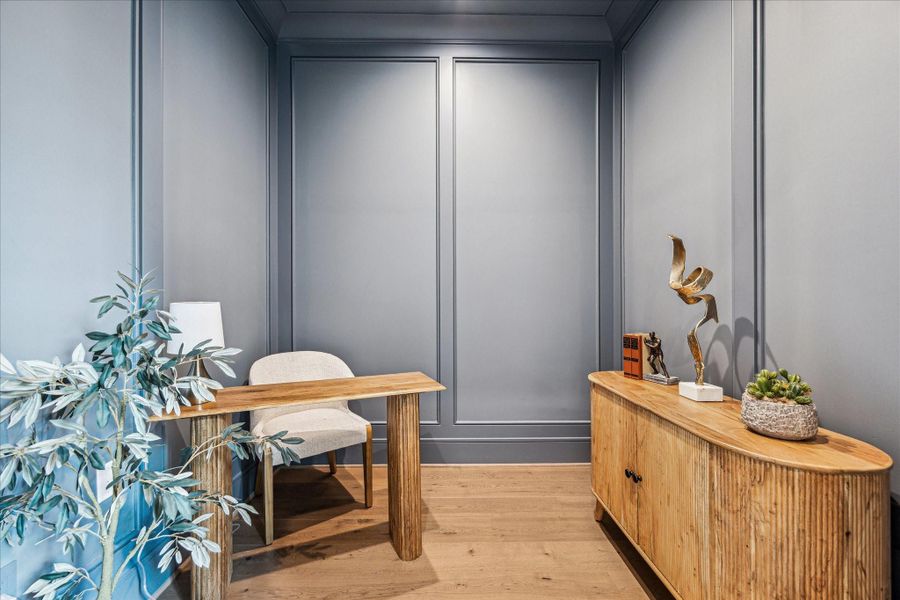 Also behind the kitchen is a great secret--this paneled home office! Work form home, keep track of recipes and budgets, or hide away with comfy chairs and a cocktail. Also behind the kitchen is a great secret--this paneled home office! Work form home, keep track of recipes and budgets, or hide away with comfy chairs and a cocktail.