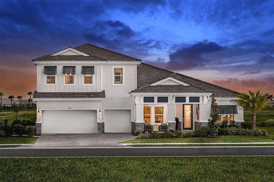 Front exterior of a new home in , Lakewood Ranch, FL, highlighting curb appeal (Image 1). Front exterior of a new home in , Lakewood Ranch, FL, highlighting curb appeal (Image 1).