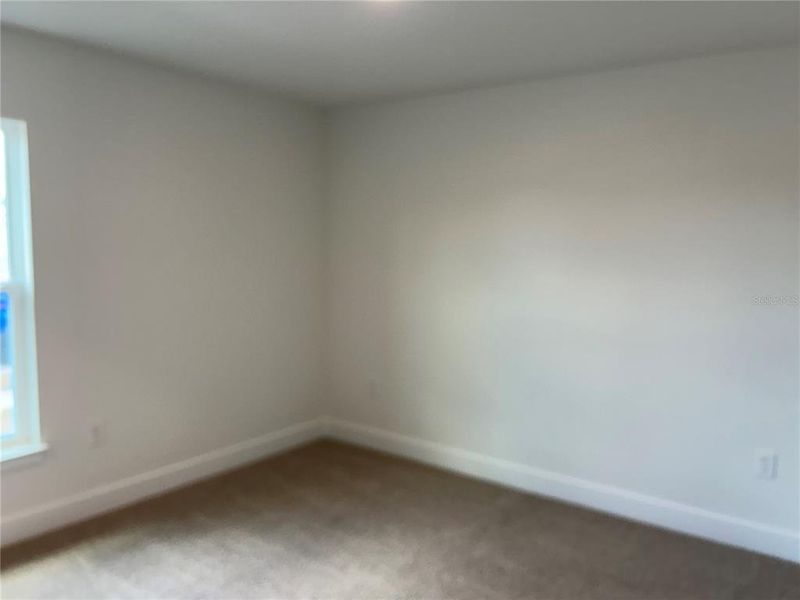 Spacious, unfurnished interior of a new home in Watercress Cove, North Port (Image 12).