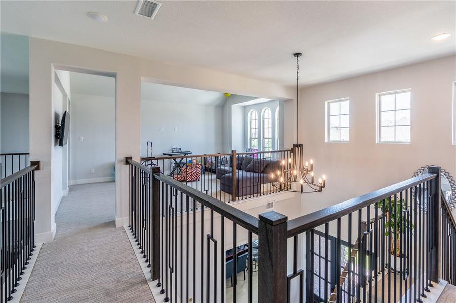 Recreation room featuring vaulted ceiling and carpet flooring