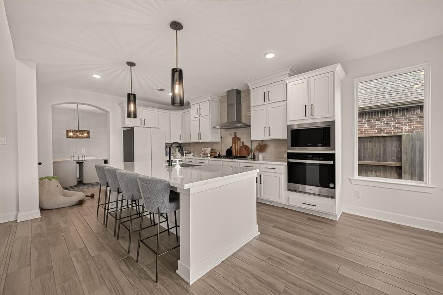 The oversized island provides plenty of seating and prep space for entertaining. The oversized island provides plenty of seating and prep space for entertaining.