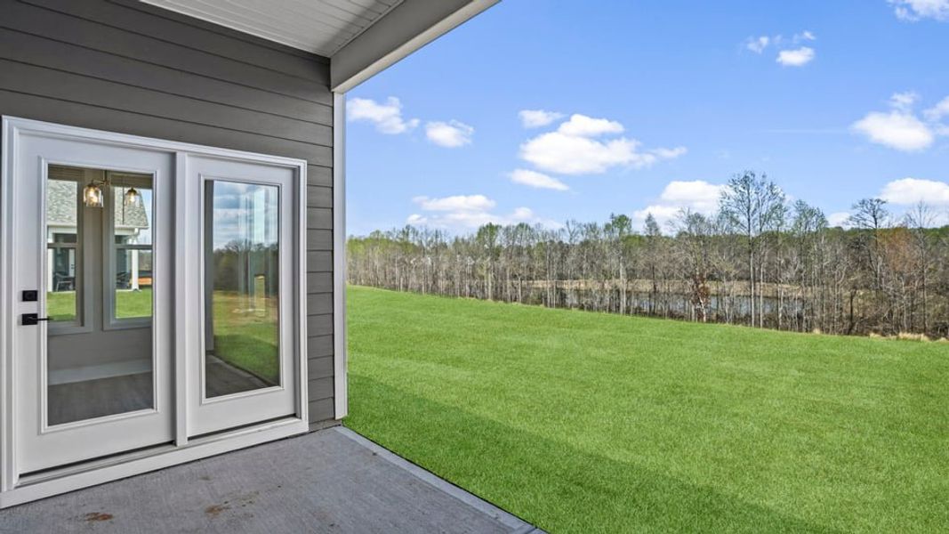 Exterior details and patio area of a home in Whitehawk Meadows, Travelers Rest (Image 19).