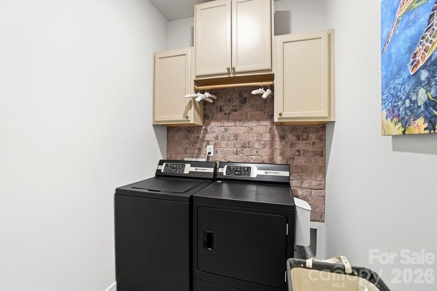 laundry room with cabinets