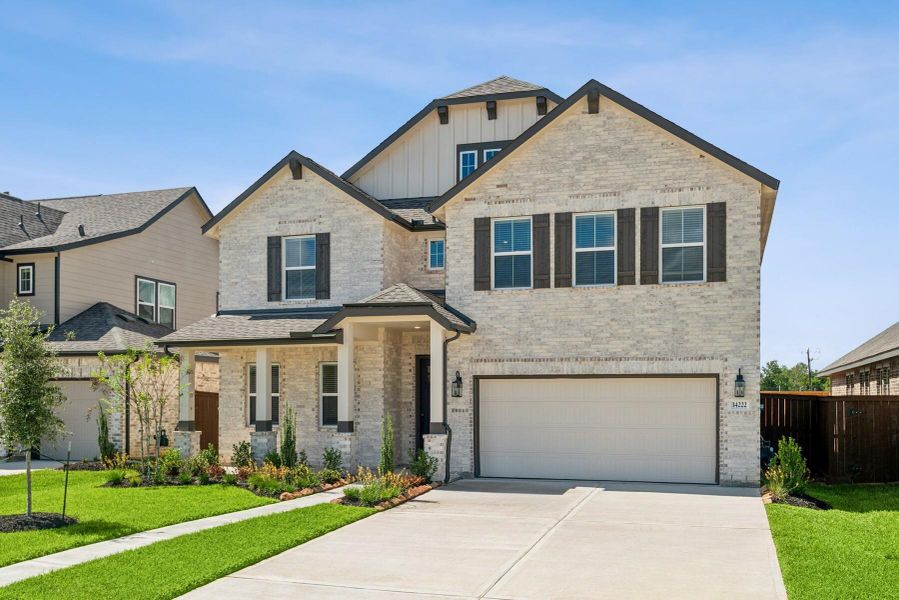 Front exterior of a new home in Harvest Pointe, Needville, TX, highlighting curb appeal (Image 2). Front exterior of a new home in Harvest Pointe, Needville, TX, highlighting curb appeal (Image 2).