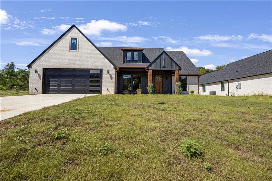 Front exterior of a new home in , Jacksonville, TX, highlighting curb appeal (Image 1). Front exterior of a new home in , Jacksonville, TX, highlighting curb appeal (Image 1).
