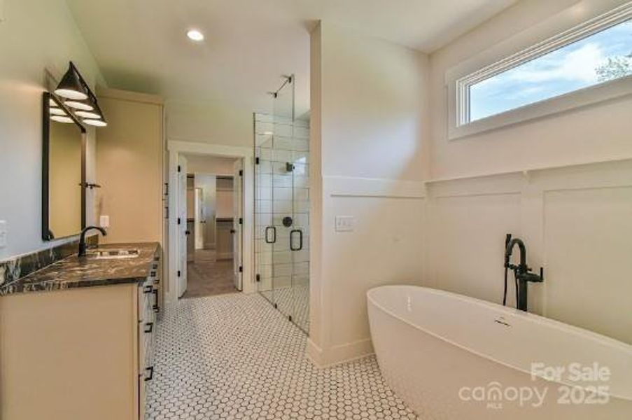 Primary Bathroom with a soaking tub. Similar photo.