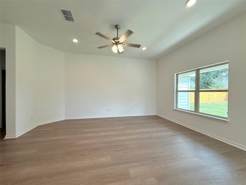Unfurnished room with recessed lighting, light wood finished floors, and ceiling fan Unfurnished room with recessed lighting, light wood finished floors, and ceiling fan