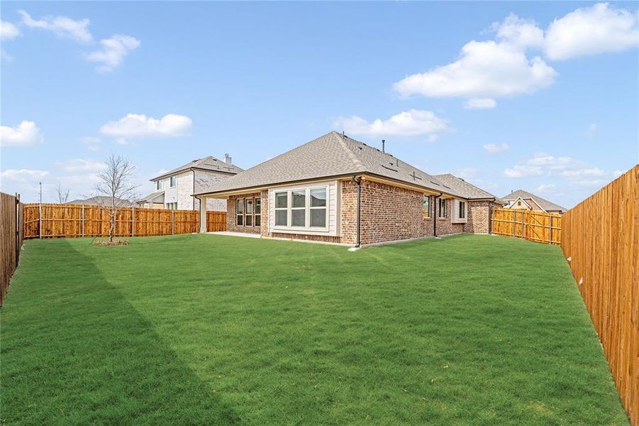 Exterior details and patio area of a home in West Crossing, Anna (Image 3). Exterior details and patio area of a home in West Crossing, Anna (Image 3).