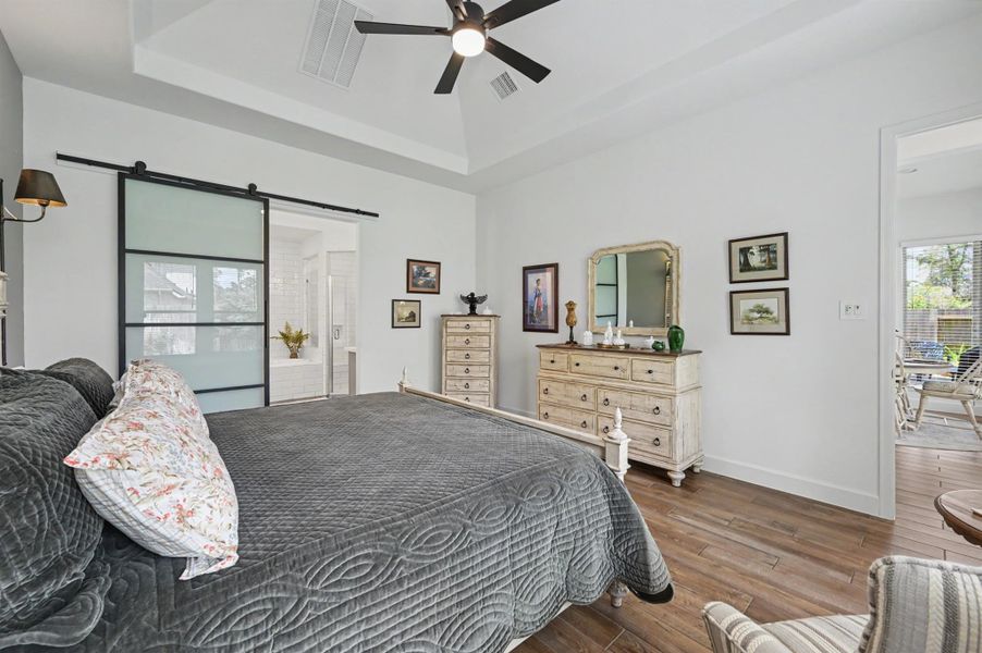 The upgraded modern barn door adds privacy to the bathroom. No doors opening into the bedroom to take up space. What a great feature! The upgraded modern barn door adds privacy to the bathroom. No doors opening into the bedroom to take up space. What a great feature!