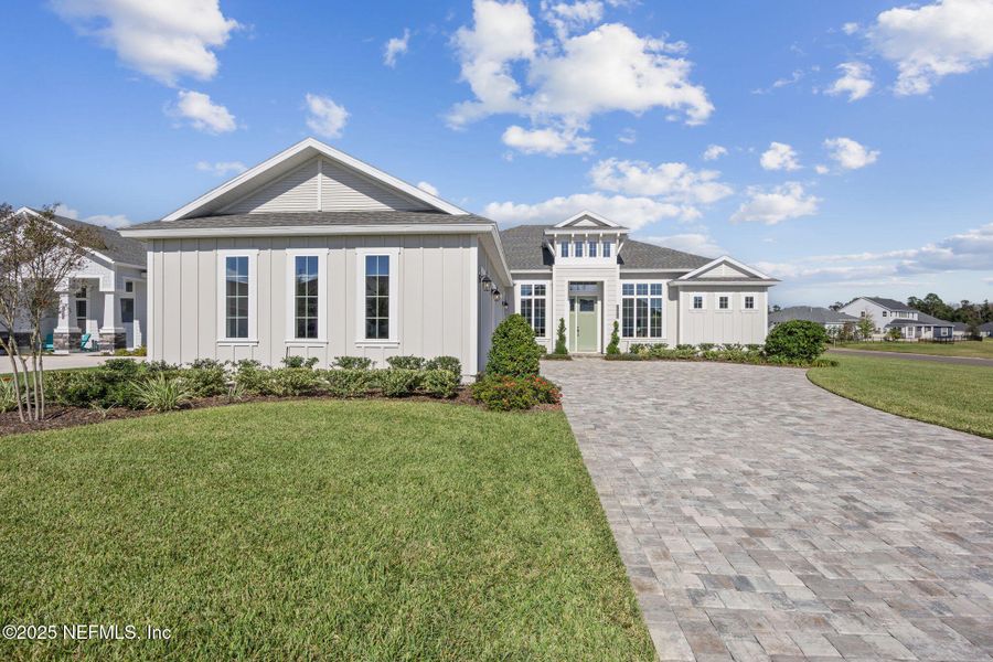 Front exterior of a new home in Amelia National, Fernandina Beach, FL, highlighting curb appeal (Image 2). Front exterior of a new home in Amelia National, Fernandina Beach, FL, highlighting curb appeal (Image 2).