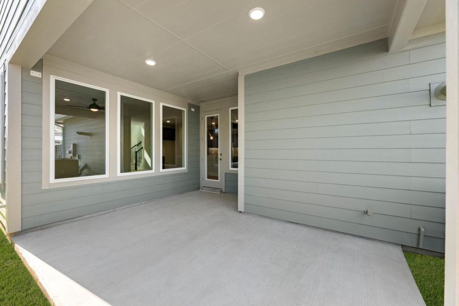 Exterior details and patio area of a home in Terrace Collection at Harvest, Argyle (Image 2).