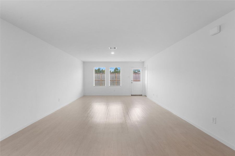 Generous 14' x 17' living room offers plenty of space for comfortable seating, a large TV and entertaining.