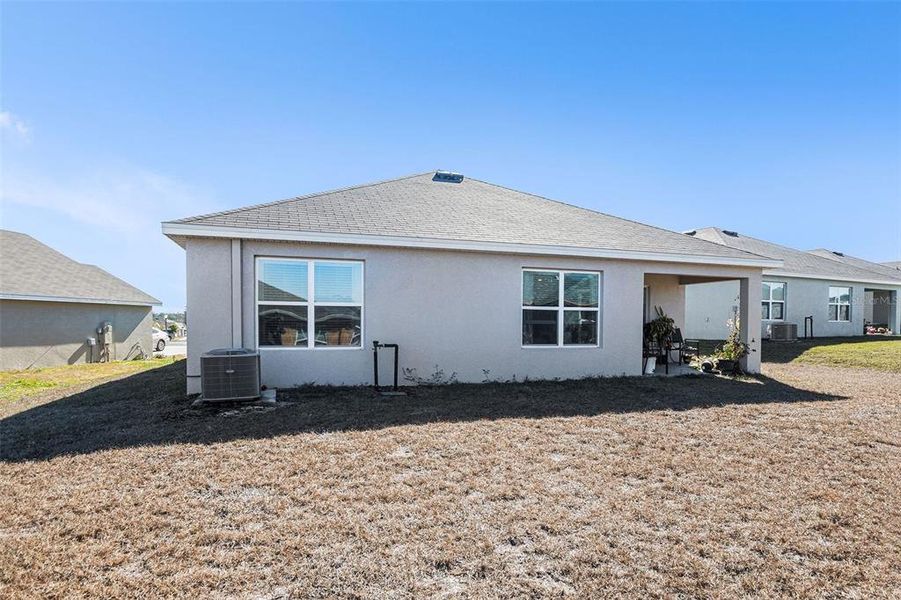 Exterior details and patio area of a home in Fairways at Twisted Oaks, Beverly Hills (Image 24).