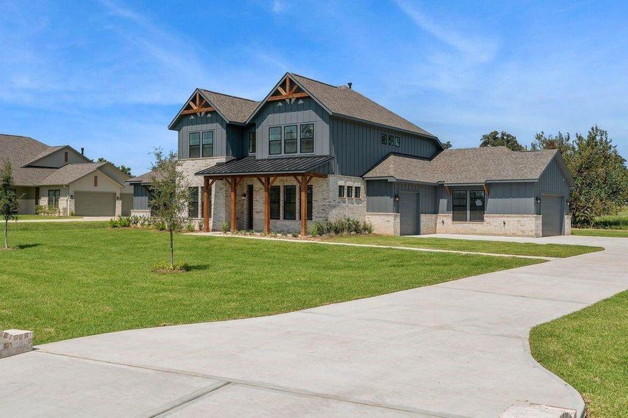 Front exterior of a new home in Chapel Bend, Montgomery, TX, highlighting curb appeal (Image 20). Front exterior of a new home in Chapel Bend, Montgomery, TX, highlighting curb appeal (Image 20).