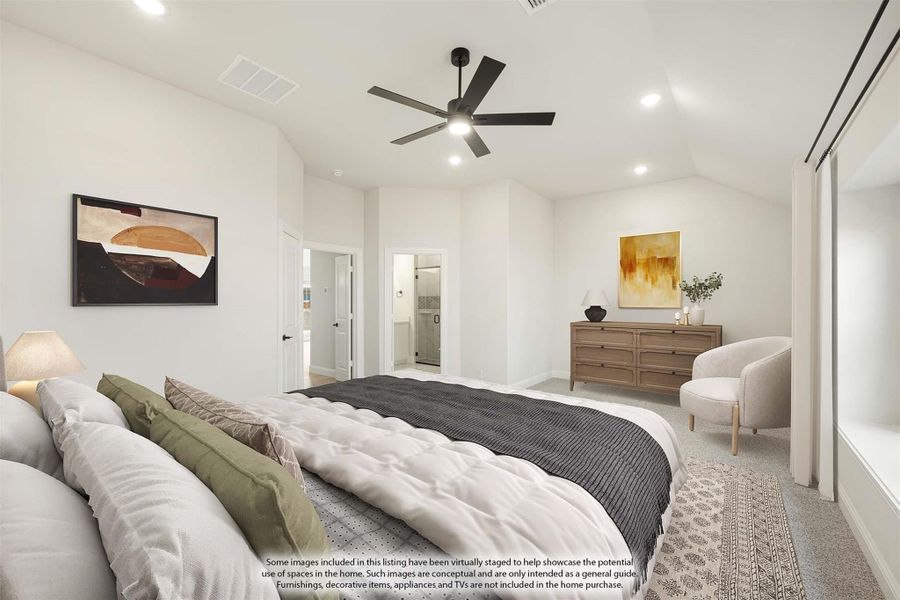 Spacious master bedroom with vaulted ceiling, ceiling fan, carpet flooring, and ensuite bathroom doorway visible.
