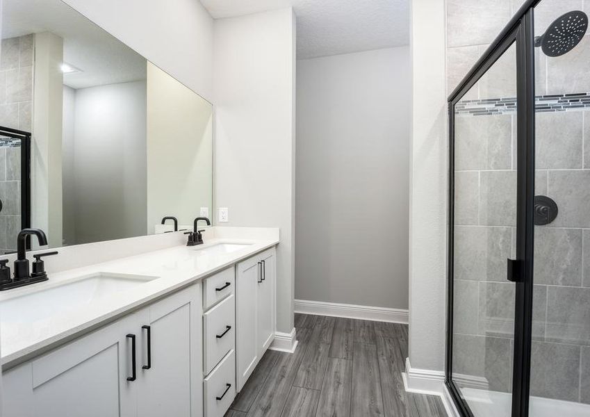 A step-in shower with modern detail in the master bathroom