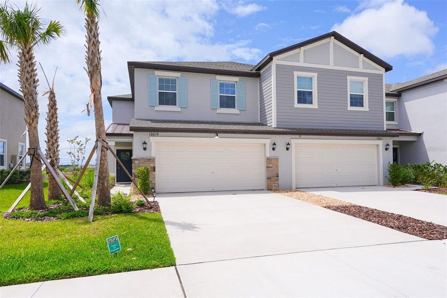 Front exterior of a new home in , San Antonio, FL, highlighting curb appeal (Image 22).