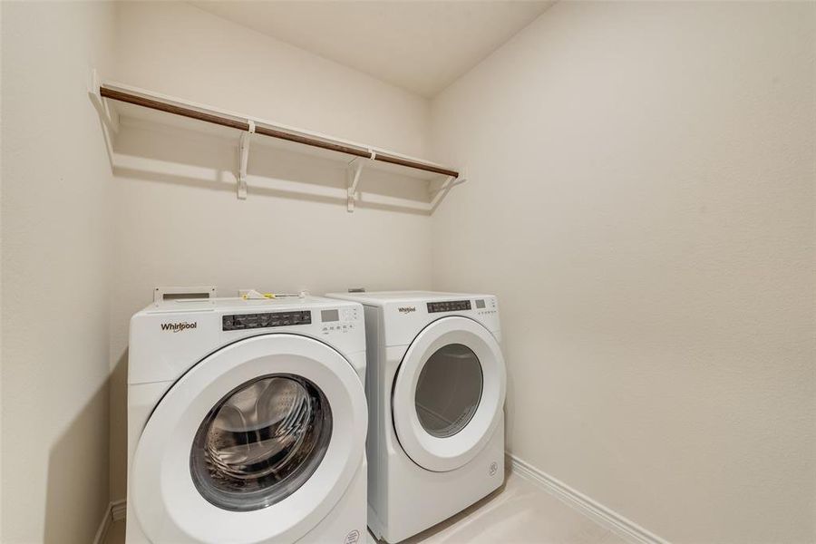 Rear view of property featuring a fenced backyard, roof with shingles, and a patio area Rear view of property featuring a fenced backyard, roof with shingles, and a patio area