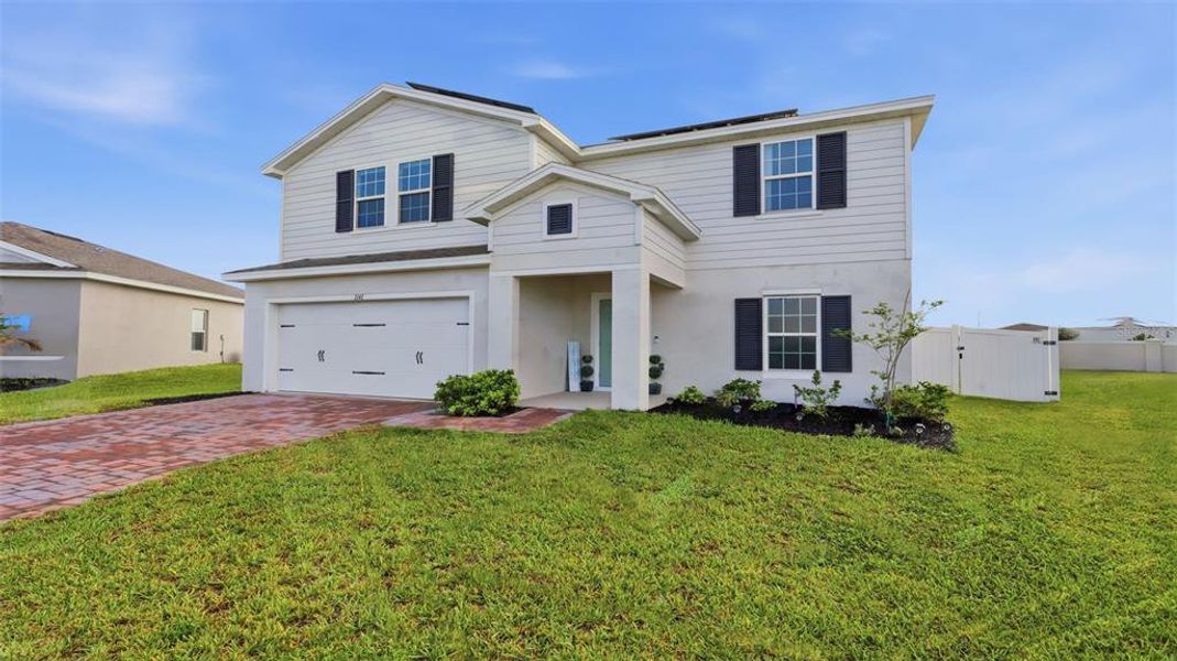 Front exterior of a new home in , Haines City, FL, highlighting curb appeal (Image 27). Front exterior of a new home in , Haines City, FL, highlighting curb appeal (Image 27).