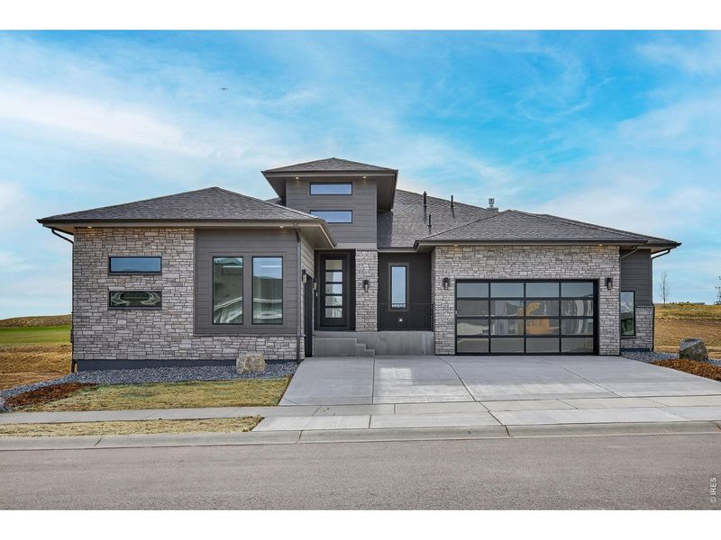 Front exterior of a new home in RainDance, Windsor, CO, highlighting curb appeal (Image 23).