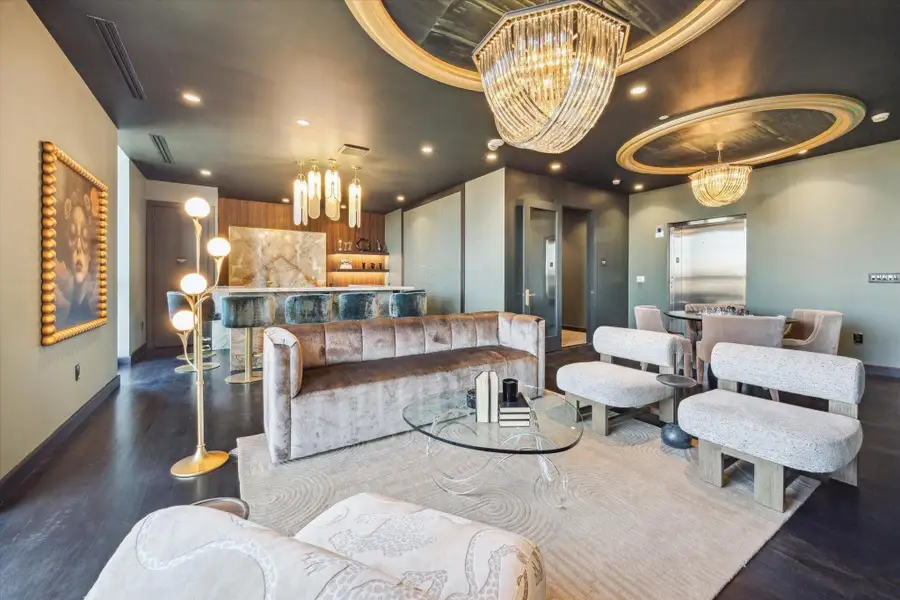 The residents lounge offers a refined setting with stylish seating, dramatic lighting, and a dedicated bar area—ideal for relaxing or entertaining in an elevated atmosphere.