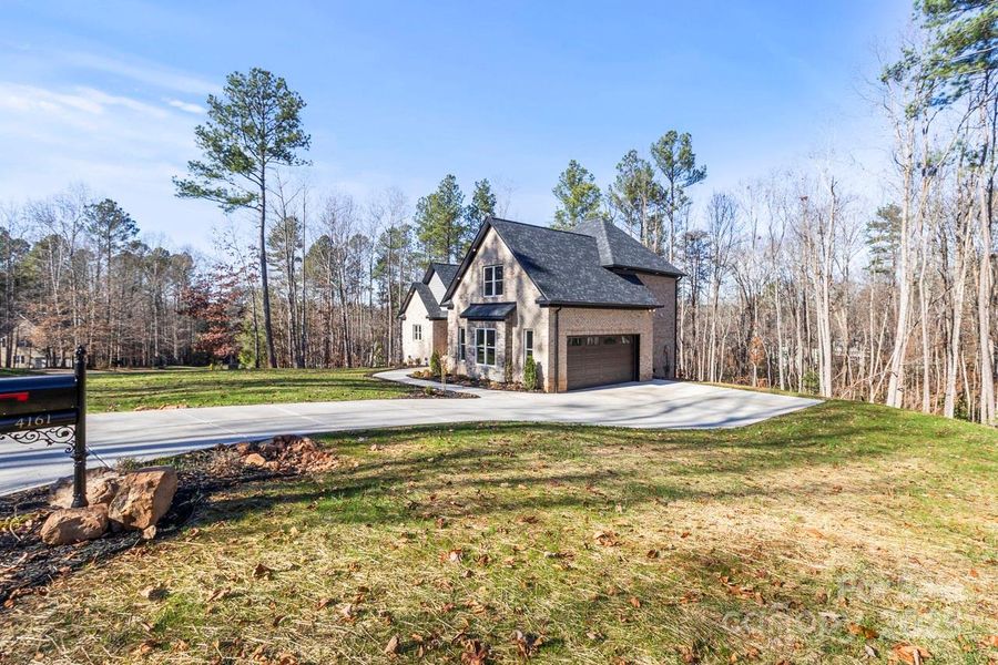 Front exterior of a new home in , Lincolnton, NC, highlighting curb appeal (Image 23).