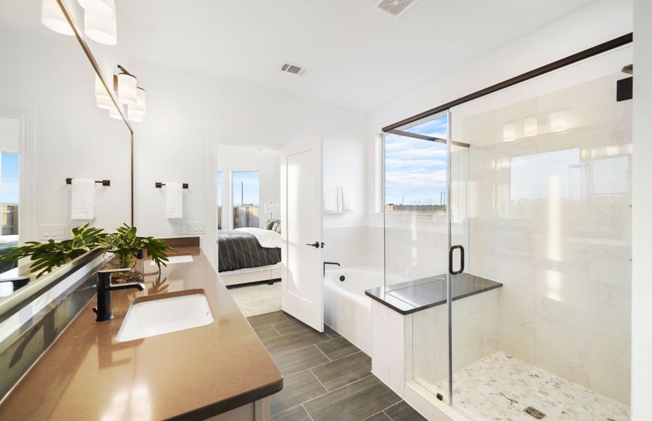 Spa-like Owner's Bath with Dual Vanities and Separate Tub and Shower