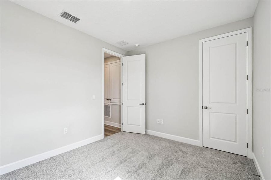 Spacious, unfurnished interior of a new home in Solace at Corner Lake, Orlando (Image 55).