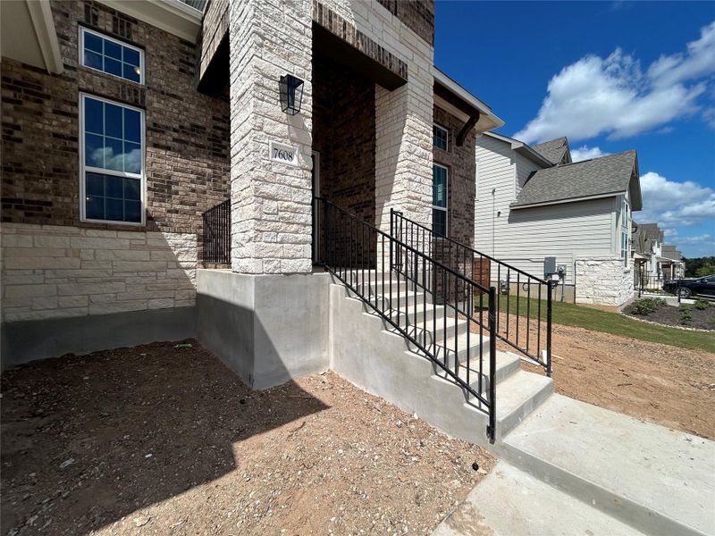 Front exterior of a new home in Provence 70s, Austin, TX, highlighting curb appeal (Image 2).