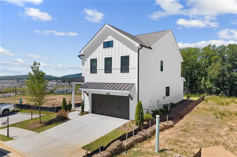 Front exterior of a new home in , Cumming, GA, highlighting curb appeal (Image 31).