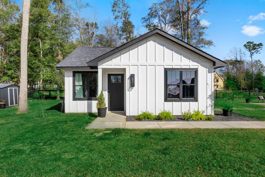 Behind the primary home is the quaint guest home.