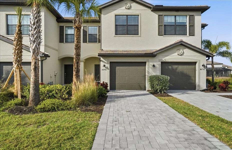 Front exterior of a new home in , Lakewood Ranch, FL, highlighting curb appeal (Image 24). Front exterior of a new home in , Lakewood Ranch, FL, highlighting curb appeal (Image 24).