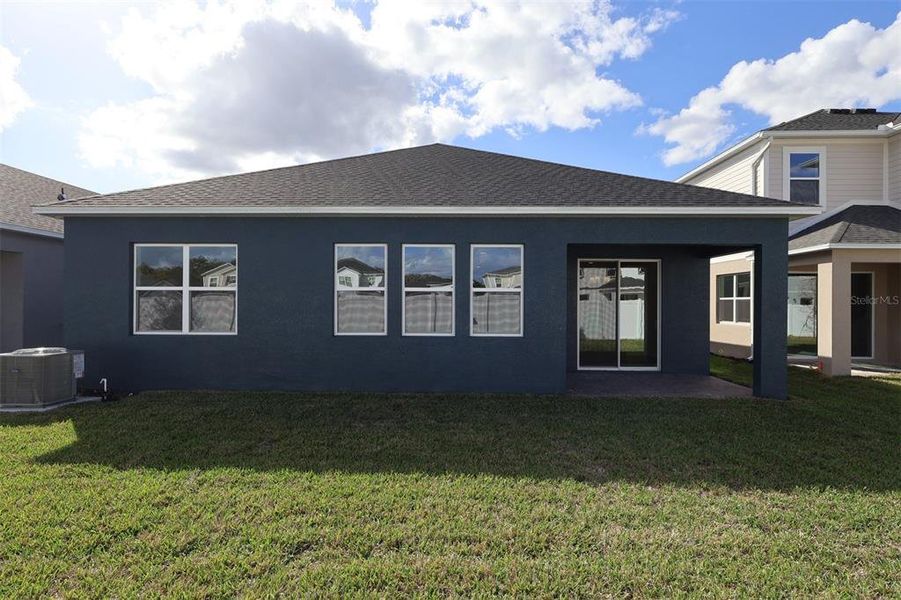 Exterior details and patio area of a home in Estates at Rivercrest, Sanford (Image 22).
