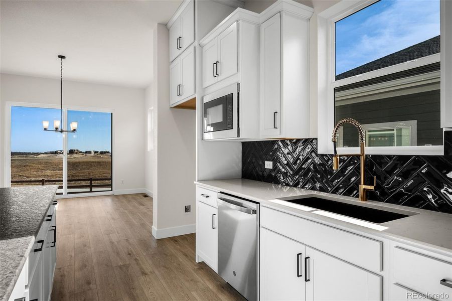 Furnished interior view inside a new home in Wolf Ranch - Enclave Collection, Colorado Springs (Image 6).
