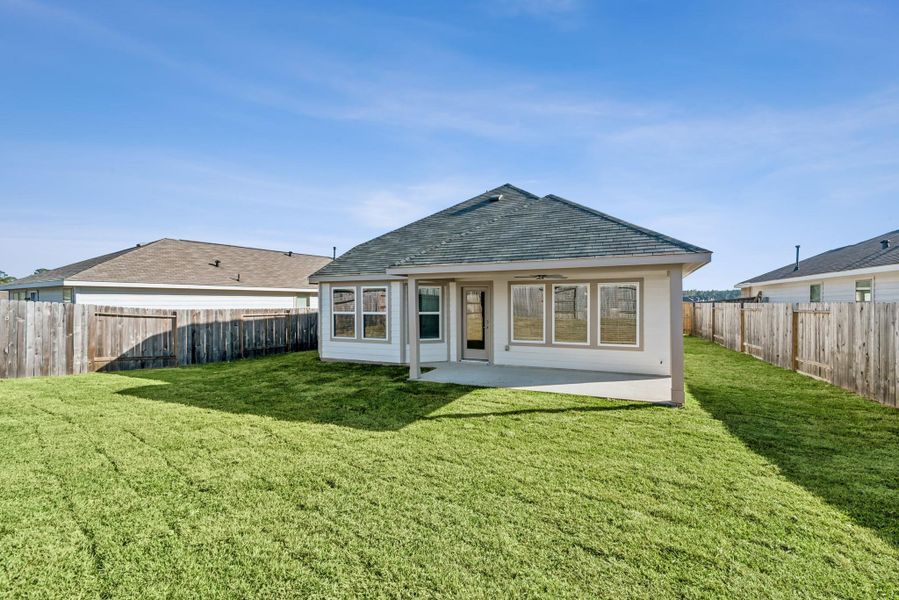 Exterior details and patio area of a home in Magnolia Ridge, Magnolia (Image 3).
