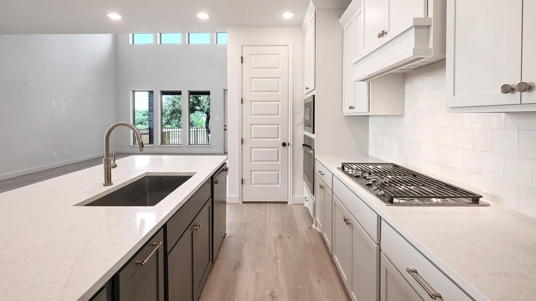 Furnished interior view inside a new home in 6 Creeks, Kyle (Image 10).