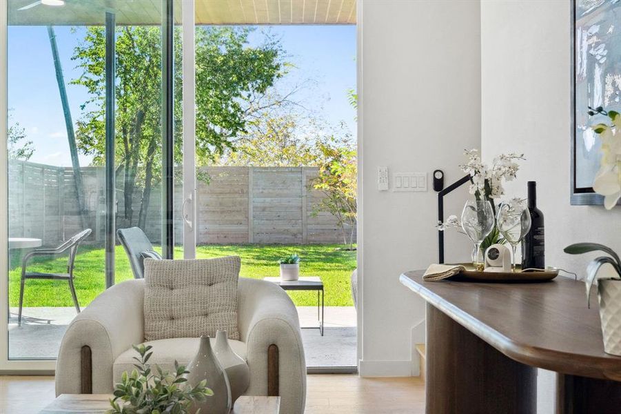 Entryway with wood finished floors and baseboards
