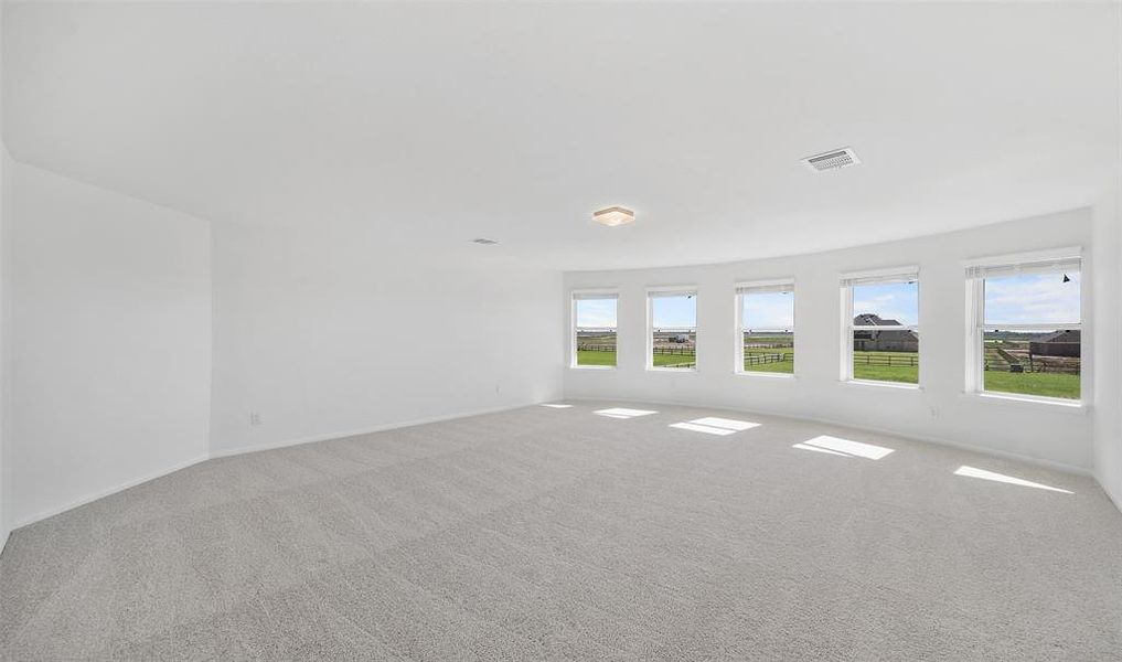 Activity room with bay windows (*Photo not of actual home and used for illustration purposes only.)