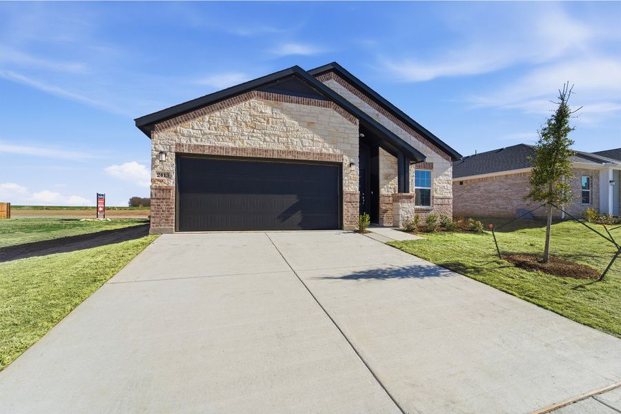 Front exterior of a new home in Pebblebrook, Sherman, TX, highlighting curb appeal (Image 2).