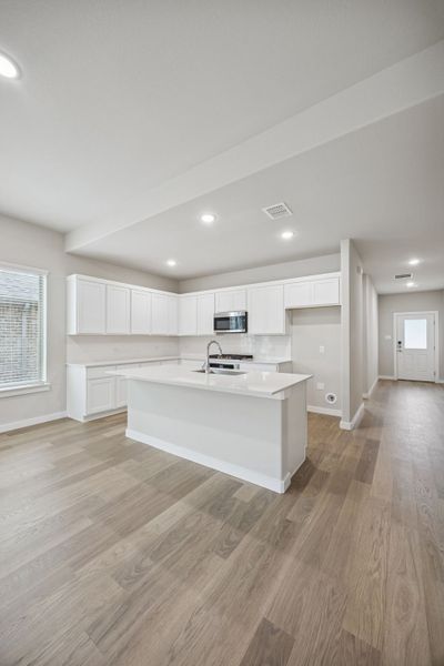 Kitchen in the Stanley II home plan by Trophy Signature Homes – REPRESENTATIVE PHOTO
