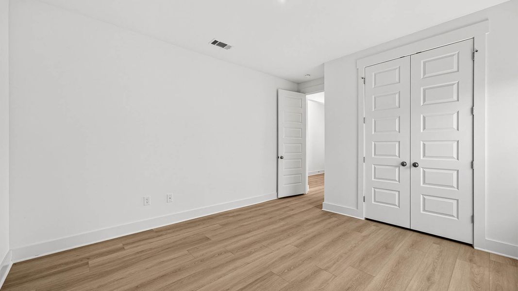 Representative unfurnished interior of a home built from the The Lily by D.R. Horton in WindMark Beach, Port Saint Joe (Image 32).