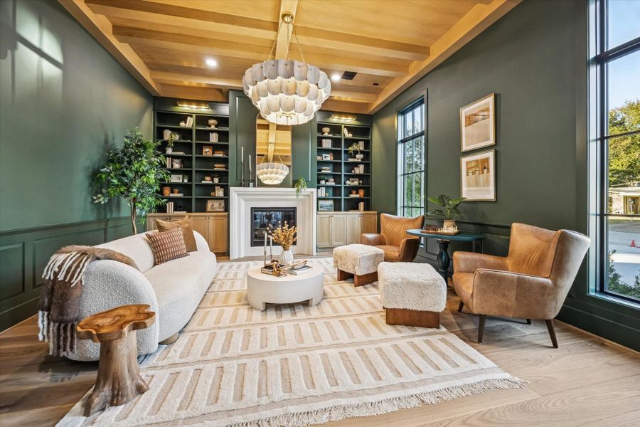 Coffered wood ceiling, full height custom built ins, and a centered fireplace establish this space as a true flex room suited for a private office, library, or formal sitting room. Tall windows and layered lighting bring in natural light while maintaining a quiet separation from the main living areas. **Previous build by Arch Angelo** Coffered wood ceiling, full height custom built ins, and a centered fireplace establish this space as a true flex room suited for a private office, library, or formal sitting room. Tall windows and layered lighting bring in natural light while maintaining a quiet separation from the main living areas. **Previous build by Arch Angelo**