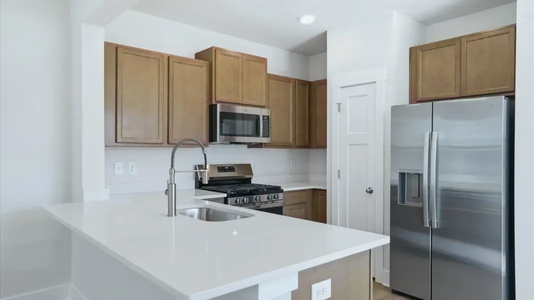 Luxury-inspired kitchen featuring expansive prep space and elegant design elements near Lake Hartwell
