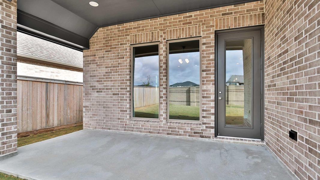 Exterior details and patio area of a home in Bridgeland, Cypress (Image 2).