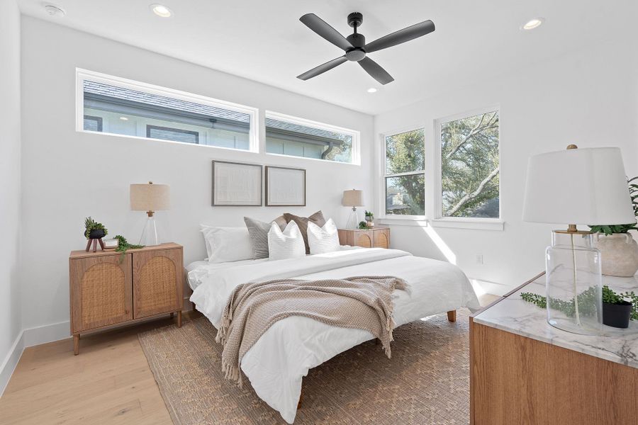 Bedroom featuring a ceiling fan, recessed lighting, light wood-style floors, and baseboards