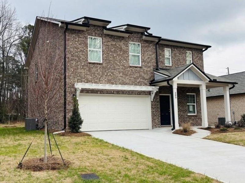 Front exterior of a new home in Kendall Grove, McDonough, GA, highlighting curb appeal (Image 1). Front exterior of a new home in Kendall Grove, McDonough, GA, highlighting curb appeal (Image 1).
