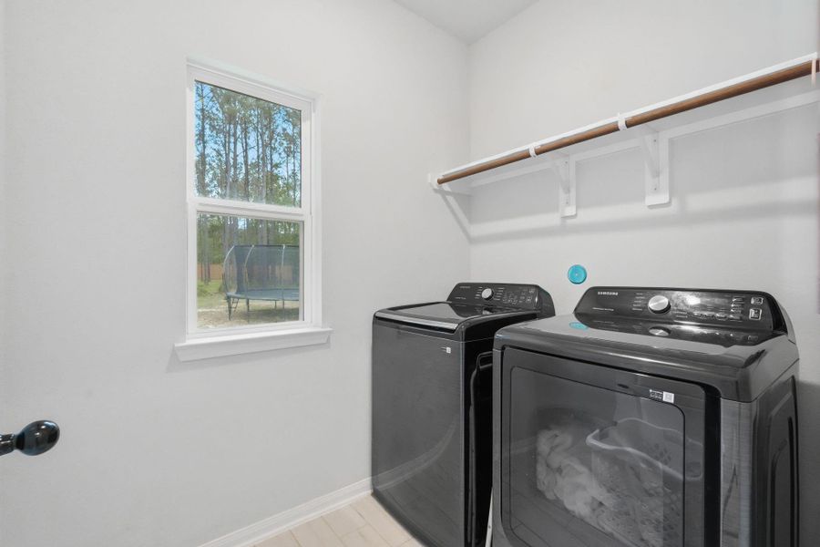 laundry room with a clean, functional setup.